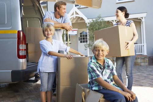 Professional movers handling furniture for a Selhurst small removal