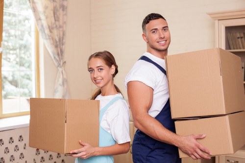 Professional man and van service handling boxes in Selhurst