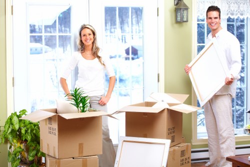 Professional movers handling furniture during a Selhurst house move